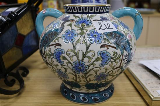 A modern Persian style two handled vase and a pair of blue and white sleeve vases